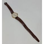 A ladies CARAVELLE wrist watch, the champagne tone dial having hourly Arabic numeral markers, case