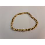 A curb link chain, yellow metal stamped with Arabic numeral, approx. length 19cm.
