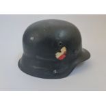 A WW2 German helmet with part double decal from the estate of Mr W.Gardener.