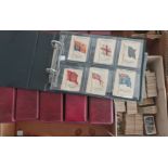 A collection of cigarette cards six albums silks loose and framed.