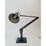 A Herbert Terry Anglepoise lamp painted black.