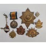 A WW1 1914-1918 medal 72974 PTE H. Clarke 1st LOND.R and cap badges to include 44 Canada, 221