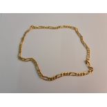 A curb link chain, with alternating length links, yellow metal stamped with Arabic numerals, approx.