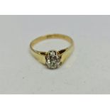 A hallmarked 18ct yellow gold diamond solitaire ring, set with a round brilliant cut diamond,