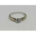 A hallmarked 18ct white gold diamond solitaire ring, set with a round brilliant cut diamond,