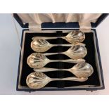 A boxed set of six hallmarked silver Mappin & Webb dessert spoons.