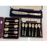 Two boxed sets of hallmarked silver teaspoons, together with a boxed hallmarked silver fish knife