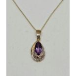 A hallmarked 9ct yellow gold amethyst and diamond pendant, on a belcher link chain stamped 375.