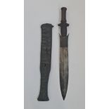 A 19th century African tribal fang sword / knife with reptile skin scabbard.