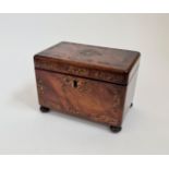 A 19th century rosewood tea caddy with mother of pearl inlaid on bun feet.