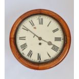 An oak round wall clock with fusee movement. 40cm.