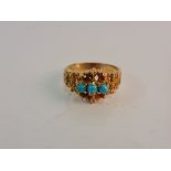 A reconstituted turquoise ring, set with three reconstituted turquoise cabochons within textured