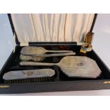 A hallmarked silver dressing table set, comprising of a hand mirror, hair brush, comb, clothes brush