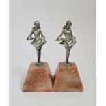 A pair of Art Deco spelter and marble book ends lady with fan.