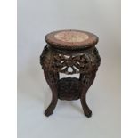 A Chinese hardwood carved table with marble top. 49 cm.