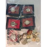 A collection of various pocket watches some on chains, some in boxes along with an oval decorative