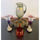 A collection of Italian coloured glass lemonade set drinking glass and candlestick.