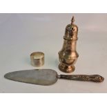 Three hallmarked silver items, to include a sugar shaker, a napkin ring and a silver handled cake