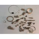 A collection of white metal and hallmarked silver jewellery to include, bangles, pendants, chains,