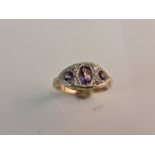 A hallmarked 9ct yellow gold amethyst and diamond cluster ring,ring size O 1/2, approx. weight 4gms