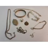 A selection of silver jewellery to include a bangle, ID bracelet, a link bracelet, various chains,(