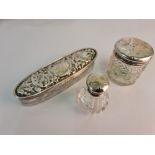 A selection of hallmarked silver to include a topped glass powder pot, a patterned lidded glass pot,