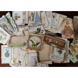 A collection of vintage greeting cards in small suitcase.