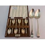 A set of hallmarked silver tea spoons in box, with two hallmarked silver serving spoons, approx.