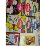 A six large Popeye carton books and together with a volume featuring the best of the Bud Sagendorf