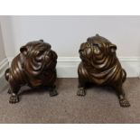 A pair of large bronze British bulldogs sitting. Approx height 47 cm.