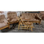 An Ercol two seater settee with two chairs and Ercol chair with no cushions.