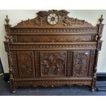 A reproduction seventh heaven oak carved 4’6 bed in the 18th century style.