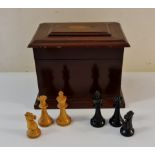 A ebony and boxwood chess board pieces in mahogany box.