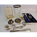 A collection of silverware to include a hallmarked silver topped glass vase, hallmarked spoons etc.