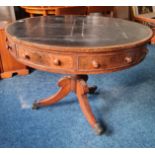 A 19th century mahogany rent table with leather finished top on a tripod base.