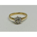 A hallmarked 18ct yellow gold diamond cluster ring, total diamond weight approx. 0.28ct, ring size