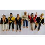 Eleven 1980s action figures to include Karate Kid, wrestling and Bruce Lee.