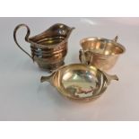 A hallmarked silver gouche bowl, a hallmarked DEPREE & YOUNG LTD. milk jug and two handled bowl