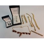 A selection of costume jewellery to include gem stone bracelets, bar brooch, pedant on chain, and
