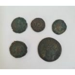 Five Roman coins.