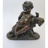 A bronze statue of Putto with hunting dog looking at a snail. Height 32 cm.