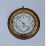 A John Barker & Co round brass wall barometer.