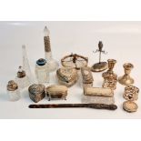 A large collection of silverware , some hallmarked to include napkin rings, glass bottles, trinket
