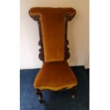 A 19th century walnut prayer chair.