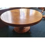 A 19th century mahogany tilt top dining table with single pedestal base.