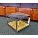 A Merrow Associates Richard Young chrome framed coffee table with glass top.
