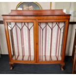 A walnut two door glazed display cabinet.