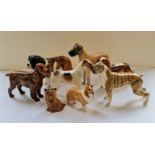 Eight Beswick dog figurines