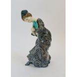 A Royal Doulton figure of a lady with fan in blue dress by E.W.Light.