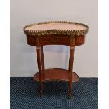 A Empire style kidney shaped side table with pink marble top and brass gallery.